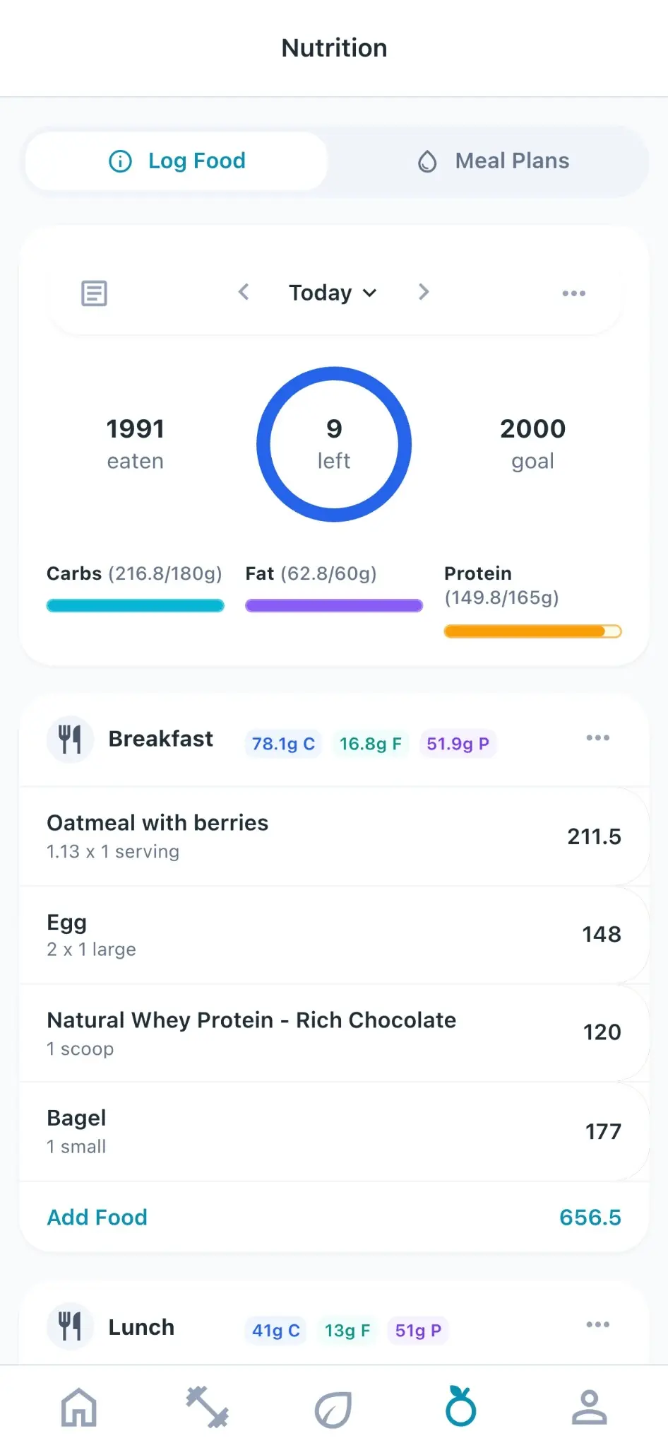 The daily food log in the Fitora client app, with calories and macros against targets